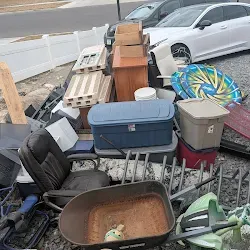 Driveway pile of household junk before haul